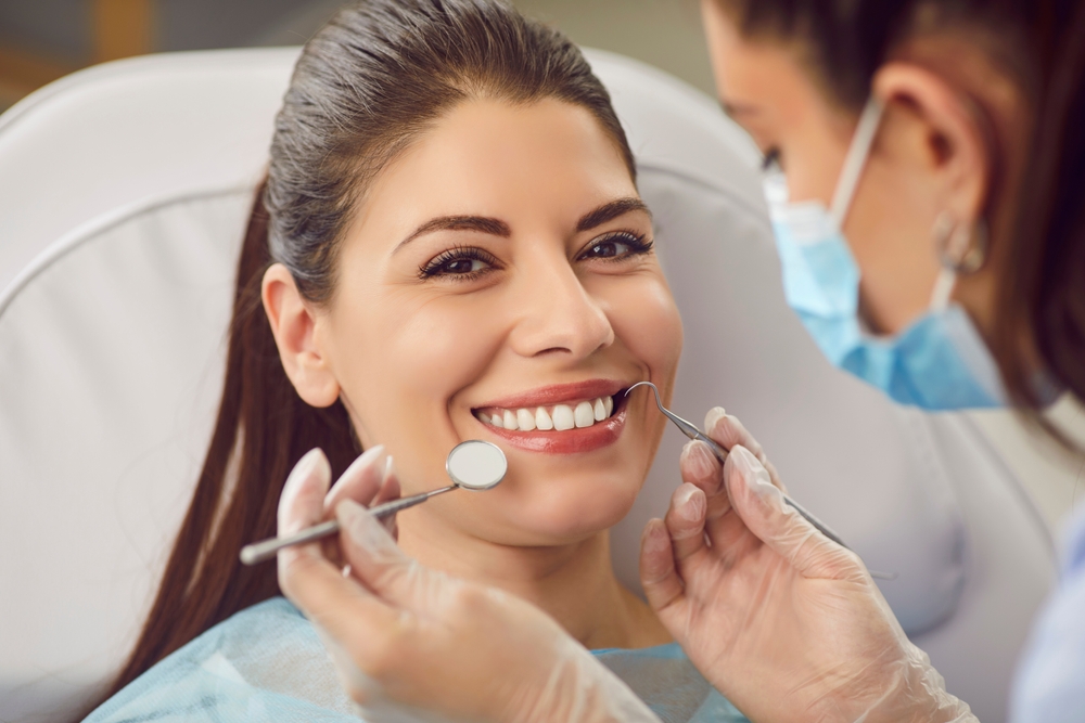 Happy patient with dentist